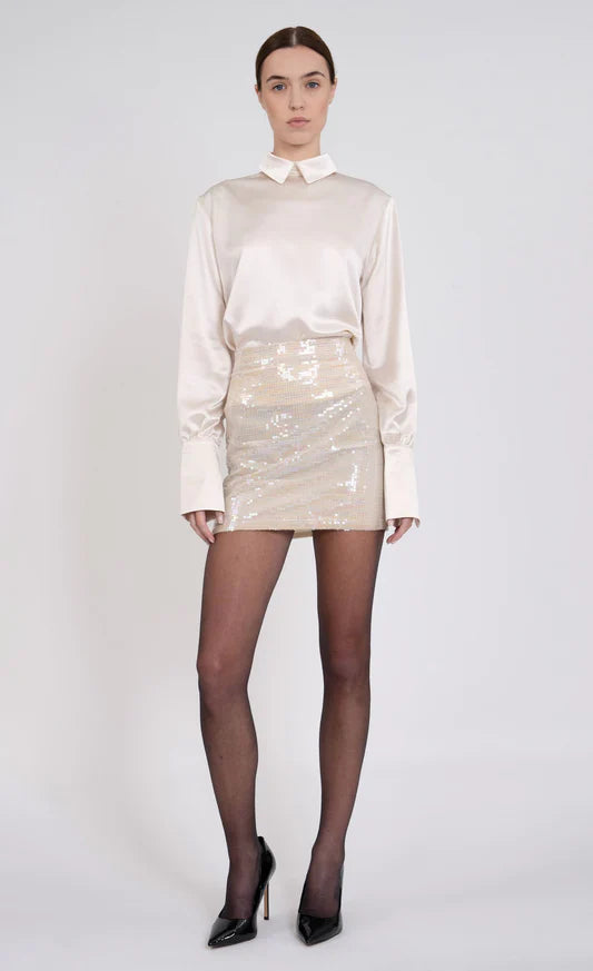 Valerie Skirt by Nonchalant | Make a statement in the Valerie Skirt, crafted from blush-tone sequins for an elegant effect. The mini skirt design is perfect for any special occasion, ensuring you make an impact at parties and other events. | Coretrade in Boca Raton, FL