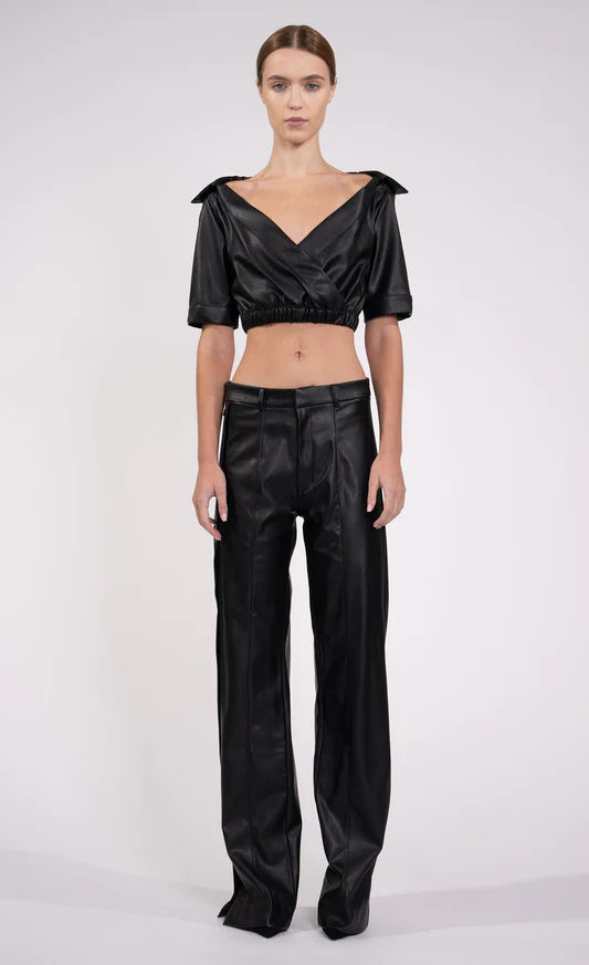 Julia Pant by Nonchanlant |  Julia Pant, a low-waisted vegan leather trouser that sets itself apart with its distinctive side snap closures. Whether you prefer to wear it as a conventional straight-leg pant or experiment with the buttoned sides for an open look | Coretrade located in Boca Raton, FL