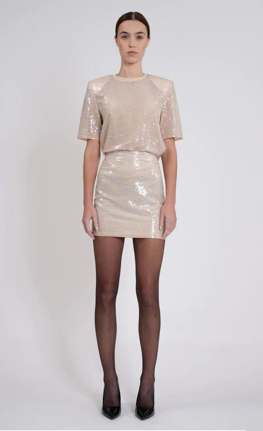 Valerie Skirt by Nonchalant | Make a statement in the Valerie Skirt, crafted from blush-tone sequins for an elegant effect. The mini skirt design is perfect for any special occasion, ensuring you make an impact at parties and other events. | Coretrade locate din Boca Raton, FL
