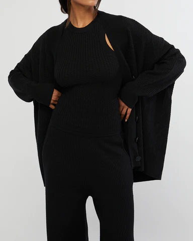 Oversized Cardigan by WeWoreWhat | oversized cardigan is made from cozy cable knit with drop shoulders and ribbed trimming. Relaxed fit Button-down | Coretrade located in  FL